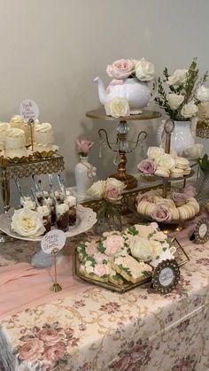 a table topped with lots of cakes and cupcakes on top of it's sides