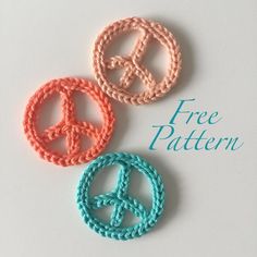 three crocheted peace signs are shown on a white background with the words free pattern