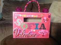 a valentine's day bag sitting on top of a couch