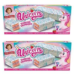 two boxes of unicorn shavings with white frosting and pink icing on them