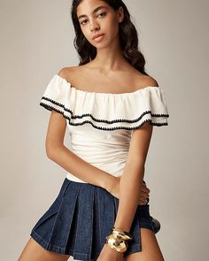 Shop this stylish off-the-shoulder ruffle top in a soft stretch cotton blend. Perfect for a chic, feminine look, this ivory top offers comfort and flair. Ideal for casual outings, date nights, or summer days, this versatile piece will elevate your wardrobe with its flattering fit and trendy design.