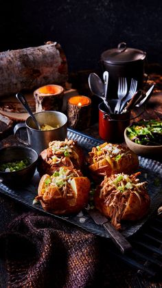 the food is ready to be eaten on the grill and served in bowls with utensils