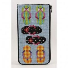 a cross stitch wallet with flip flops and cactuses on the front, in blue