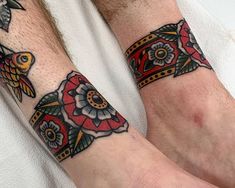 two people with matching tattoos on their arms