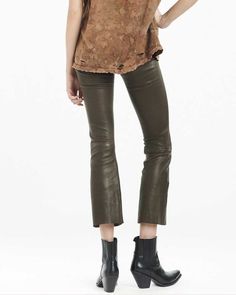 The SPRWMN Leather Crop Flare Leggings are a brand favorite due to its comfortable and wide elastic waistband, cropped length, and smooth stretch leather. Tailored in a dark army green shade, style yours with anything from sneakers to pumps, or party tops to simple tees. 100% Leather High-waisted Slim fit Pull on Raw hem Professional leather cleaning only Flare Legging, Crop Flare, Simple Tees, Cropped Flares, Flare Leggings, Leather Cleaning, Party Tops, Shades Of Green, Army Green