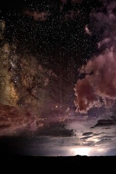 the night sky is filled with stars and clouds