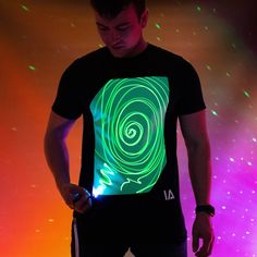 Interactive Glow T-shirt in which you can customise with light. A unique interactive glow t-shirt for adults; Using the included Glow pen or a mobile phone torch you can create your own designs on the clothing - again and again! They are perfect for everyone - whether you're at a festival, at home with the family, out with the friends, and kids love it too! Makes the perfect gift! The glow effect lasts between 5-10 minutes, before fading away completely. This means you can keep interacting with the t-shirt throughout your day or night. The T-shirts are machine washable, perfect for when you come back from a festival or a children's party. As they are 100% cotton, they feel great to wear due to the natural fibres. Each T-shirt includes a UV Keyring lanyard, allowing you to charge up the glo Interactive Design Ideas, Festival At Home, Space Balls, Family Holiday Gifts, Clear Tumblers, Led Dog Collar, New Orleans Mardi Gras, Glow Stick, Real Magic