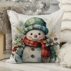 a pillow with a snowman on it