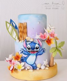 the cake is decorated with an image of stitchy from lilpui and flowers