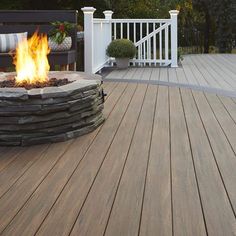 a fire pit sitting on top of a wooden deck