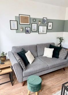 a living room filled with lots of furniture and pictures on the wall above it's couch