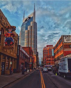 a city street filled with lots of tall buildings