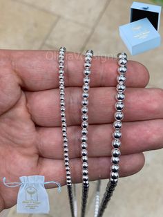 Brand New 925 Sterling Silver Ball Bead Chain Known as Ball, Bead, Dog Tag, Dog Tag ID Necklace Beautiful Shine To It Please Choose From The Following 3mm, 4mm, 5mm All Sizes 16'' 18'' 20'' 22'' 24'' 30'' MATERIAL: Guaranteed Genuine 925 Sterling Silver - Not Plated  Made In Italy - Stamped -These Chains are Italian Factory made from Genuine .925 Sterling Silver, Stamped Italy 925. -Guaranteed Genuine .925 Sterling Silver, Not Filled or Plated. -The Quality of these Chains are Excellent and Made to Last. -Each buyer will receive a Brand New, High Polished, Beautiful piece of Jewelry. Lobster Clasp Estimated Weights: 3mm 16'' 12 Grams 18'' 13 Grams 20''15 Grams 22'' 17 Grams 24'' 18  Grams 30'' 22.5 Grams 4mm 16'' 16.5 Grams 18''  20 Grams 20'' 22.5 Grams 22'' 24 Grams 24'' 26.5 Grams 30'' Silver Beaded Bracelets With Ball Chain, Silver Single Strand Beaded Bracelets As Gift, Silver Single Strand Beaded Bracelet Gift, Silver Beaded Bracelet With Ball Chain As Gift, Hypoallergenic Silver Necklace With Round Beads, Bead Chain Necklace, Ball Necklace, Bead Chain, Dog Tag