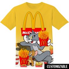 a t - shirt with an image of a cat and mouse in front of mcdonald's