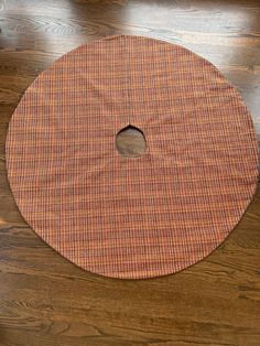 a wooden table with a round cutting board on it