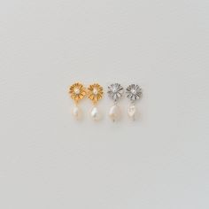 "Dainty Chamomile Flower Stud Earrings with Freshwater Pearl Drops D E T A I L S - Dainty chamomile flower motif with freshwater pearl at drop - Available in gold and silver finish - This listing is for a PAIR - Flower size: 10x10 mm / 0.4x0.4 \" - Pearl size: approximately 8mm / 0.31 \" - Each pair comes in a lovely gift box, ready for gifting. - Pearl shapes can vary. Any questions? Feel free to convo me for any questions! Thank you for browsing. M O R E W A Y S T O P E R S O N A L I Z E : - D Dainty Pearl Drop Flower Earrings, Dainty Flower Bridal Earrings, Delicate Hypoallergenic Flower Earrings For Wedding, Dainty Hypoallergenic Flower Earrings For Wedding, Hypoallergenic Drop Flower Earrings For Wedding, Chamomile Flower, Dinosaur Necklace, Flower Drop Earrings, Drop Earrings Gold