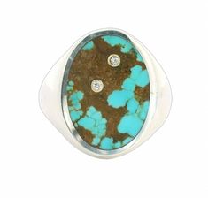 This large sterling silver signet ring holds hidden treasure. In the inlaid Number 8 Turquoise is hidden two golden bezel set white diamonds. A pop of sparkle amidst the speckled pattern of the brown and blue turquoise. A large ring to wear on the middle finger, casual but with a hidden flash of luxury! This ring is a size 10 and can not be resized. Inlay Jewelry, Signature Rings, Crown Print, Hidden Treasure, Silver Signet Ring, Brown And Blue, Number 8, Large Ring, Classic Ring