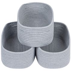 three grey woven baskets stacked on top of each other