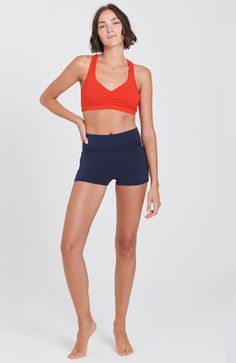 From hot yoga to a jog in the sunshine, these shorts will never let you down. Waistband option to roll down or wear high. Soft 4 way stretch fabric deliver great comfort and versatility! 92% Cotton, 8% Lycra. Made in USA. Hand Dyed. Outer Seam: 25.5"Colors: Navy, Black, Stella Blue Model is 5'9," size 4, and wearing a size small. Shown with the Raja Bra Versatile Go-dry Shorts For Summer, Versatile 4-way Stretch Athletic Shorts For Summer, Versatile Athletic Shorts With 4-way Stretch For Summer, Athletic Fit Yoga Shorts, Summer Yoga Bottoms With Athletic Fit, Solid Sportswear Shorts For Yoga, Yoga Activewear With Built-in Shorts, Go-dry Athletic Shorts For Yoga Summer, Go-dry Yoga Athletic Shorts For Summer