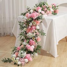 the table is decorated with pink and white flowers