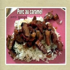 a pink plate topped with rice and meat