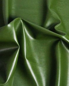 a close up view of a green leather material