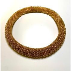 This is part of Chairish’s Costume Jewelry assortment.  Spectacular Vintage CINER Jewelry Yellow 18k Gold Plated Metal Caviar or Bubble Designs Beaded Collar Necklace from the early 1980s.  17" by 1.5" thick Gold Necklaces With Round Beads For Evening, Luxury Gold Choker For Evening, Luxury Gold Evening Choker, Gold Round Beads Evening Jewelry, Formal Gold Flexible Necklace, Gold Choker With 17 Jewels, Handmade Gold Bracelet For Evening, Elegant Handmade Yellow Gold Choker, Ciner Jewelry