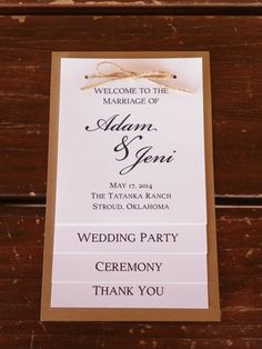 a wedding welcome card hanging on the side of a wooden door