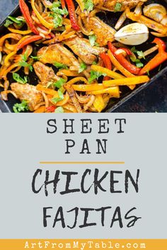 sheet pan chicken fajitas with peppers and onions in it on a black tray