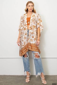 Experience beautiful, effortless style in this gorgeous Gold Floral Kimono! Feel luxurious and confident in the graceful side slits and eye-catching border print. Enhance any look with this stunning staple and make a lasting impression! Don't miss out - get yours today! Patterned Kaftan For Spring, Flowy Rayon Kimono, Summer Paisley Print Kaftan, Long Kimono With Paisley Print For Summer, Bohemian Kaftan For Day Out, Long Summer Kimono With Paisley Print, Paisley Print Kaftan For Vacation, Summer Bohemian Kaftan With Printed Motifs, Bohemian Rayon Kimono