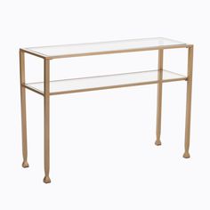 a glass and brass console table with two shelves