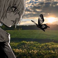 a person standing in a field with a butterfly flying over them