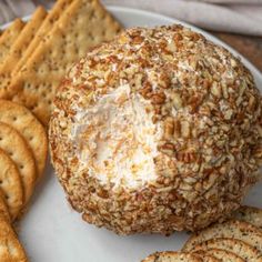 a cheese ball and crackers on a plate