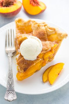 a slice of peach pie with ice cream on top