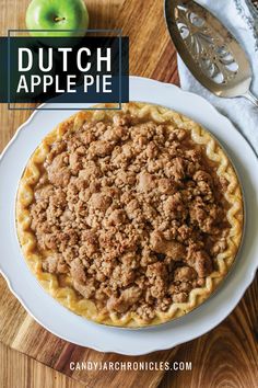 an apple pie on a white plate with the words dutch apple pie in front of it