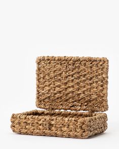 two woven baskets sitting on top of each other