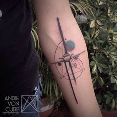 a tattoo on the arm of a person with a clock and an eyeball in it