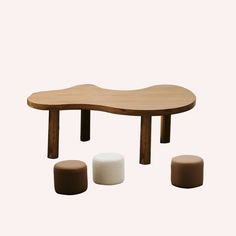 three stools and a table made out of wood with different materials on top of them