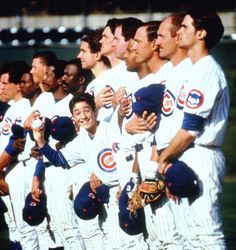 a group of baseball players standing next to each other