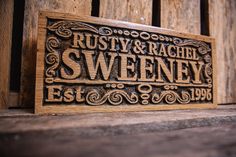 a wooden sign that says rusty & rachel sweeney