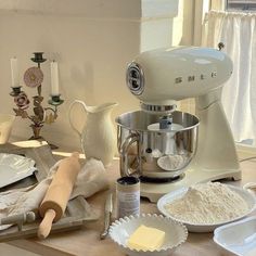 the kitchen counter is cluttered with ingredients for making cookies and pies, including butter