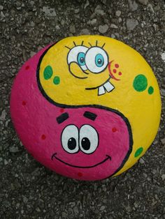 a painted rock with a smiley face on it