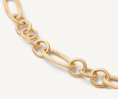 This chain bracelet is made up of oval elements in 18K yellow gold, finely hand-engraved using the ancient Florentine technique, alternated with circular elements in polished gold. The interplay of polished and engraved finishes gives the piece a brilliant yet discreet quality: a new chain model with a strong character. Luxury Figaro Chain Bracelet With Oval Link, Luxury Oval Link Chain Bracelet With Figaro Chain, Engraved Oval Link Yellow Gold Bracelet, Engraved Yellow Gold Oval Link Bracelet, Luxury Bracelet With Figaro Chain And Oval Link, Luxury Yellow Gold Figaro Chain Bracelet, Elegant Engraved Oval Link Chain Bracelet, Engraved Link Yellow Gold Bracelet, Engraved Yellow Gold Link Bracelet