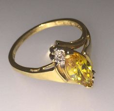 14K Yellow Gold Golden Zirconia of fine vivid yellow colour Round brilliant cut diamonds Ring's size: N (can be resized) Total item's weight: 2.6gr.  Comes with box & valuation Yellow Oval Brilliant Cut Diamond Ring, Yellow Oval Diamond Ring Fine Jewelry, Yellow Oval Diamond Ring, Fine Jewelry, Fine Jewelry Yellow Oval Diamond Ring, Oval Yellow Diamond Ring For Anniversary, Yellow Diamond Ring With Diamond Accents, Yellow Diamond Ring With Accents, Yellow Diamond Ring With Accents, Round Cut, Yellow Diamond Rings With Diamond Accents