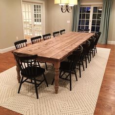 a large wooden table sitting in the middle of a room