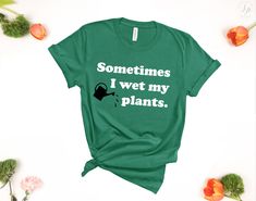 "This shirt makes a great gift for the gardener friend or Crazy plant lady in your life! UNISEX JERSEY SHORT SLEEVE TEE WHEN PURCHASING IN THE NOTES TO SELLER BOX PLEASE LIST: 1. Date needed by PRODUCT INFO: Brand: Bella + Canvas Features: Sideseamed. Unisex sizing. Shoulder taping. UNISEX SIZING Featured Photo: Heather Olive SIZING: -See Sizing Chart SHIPPING INFO: Expected ship dates: Reference the \"ready to ship\" times displayed on this listing. \"Ready to Ship\" times do not include the ti Green T-shirt With Plant Print For Gardening, Green Tops With Letter Print For Gardening, Green Plants Print T-shirt For Gardening, Green T-shirt For Gardening In Summer, Garden Shirt, Plant Mama, Feminism Shirt, Taylor Swift Shirts, Mardi Gras Shirt