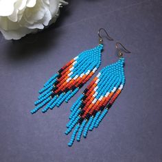 Blue Beaded Fringe Tassel Earrings For Summer, Summer Blue Beaded Earrings With Tassels, Blue Tassel Earrings With Colorful Beads For Summer, Summer Blue Tassel Earrings With Colorful Beads, Turquoise Fringe Earrings For Summer, Blue Beaded Fringe Earrings For Summer, Summer Blue Beaded Earrings With Fringe, Turquoise Beaded Fringe Tassel Earrings For Summer, Fringe Bead Earrings