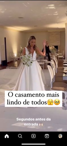 a woman in a wedding dress standing next to a table