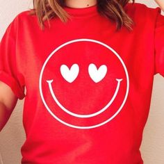 Red Heart Eyes Smiley Face Valentine Graphic Tee 100% Airlume Cotton Valentines Valentine Graphic, Valentines Graphic Tee, Pink Choker, Metallic Shorts, Green Polo Shirts, Black Short Sleeve Shirt, Drop Shoulder Tee, Red T, Heart Eyes