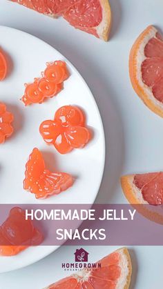 homemade jelly snacks on a white plate with grapefruit slices and oranges in the background